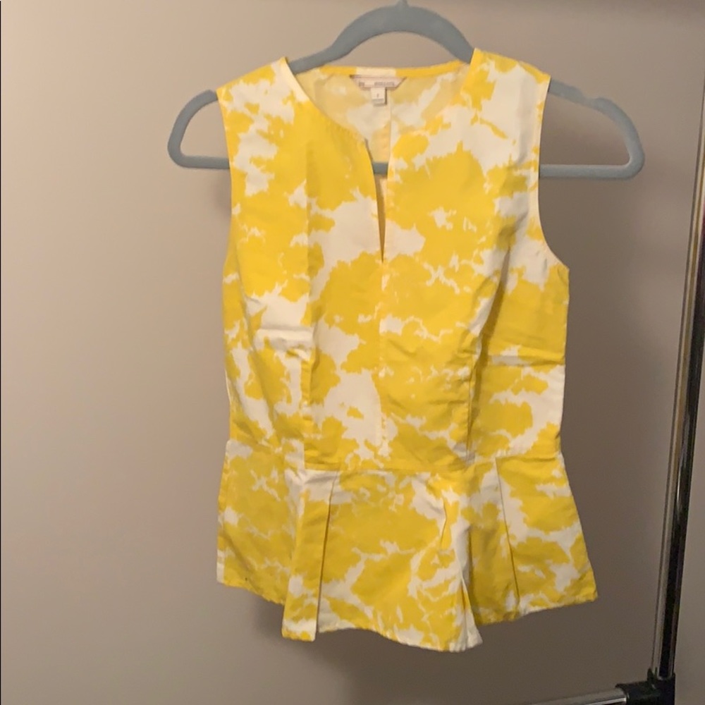 Sleeveless yellow and white casual/dress top.